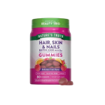 Bottle of Nature's Truth Hair, Skin & Nails gummies with biotin 2,500 mcg, fruit flavor, vegan & non-GMO on a pink-label bottle.