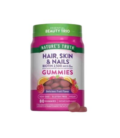 Bottle of Nature's Truth Hair, Skin & Nails gummies with biotin 2,500 mcg, fruit flavor, vegan & non-GMO on a pink-label bottle.